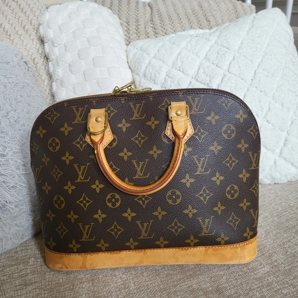Authentic Louis Vuitton Monogram Alma PM Hand Bag..